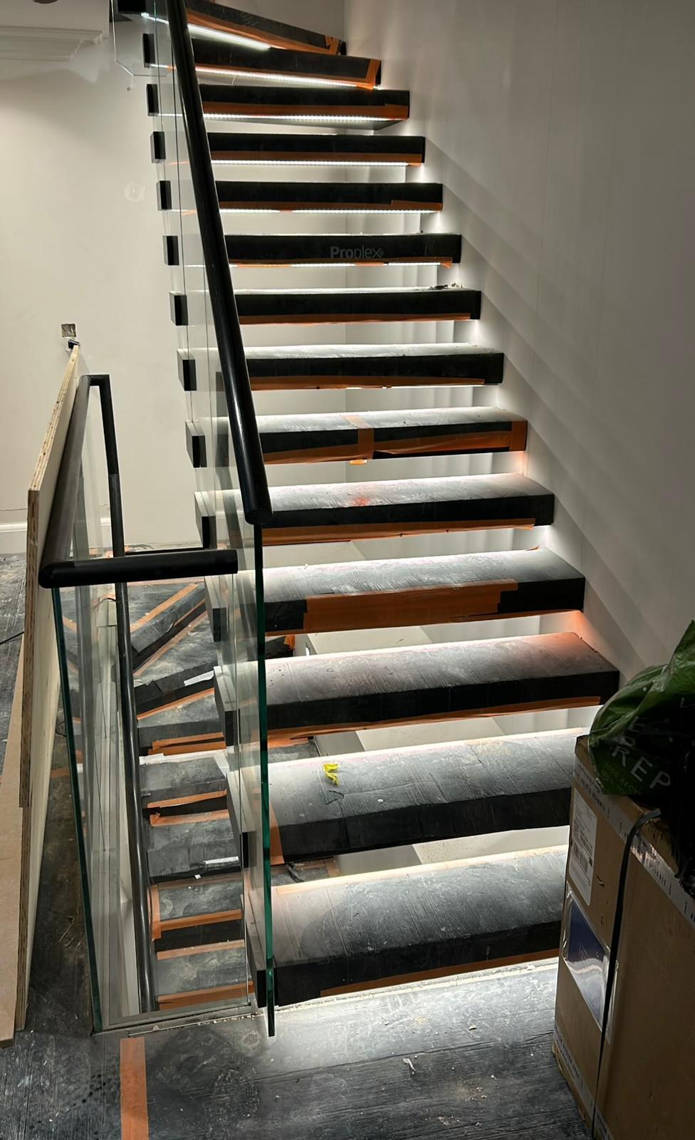 LED under-tread staircase lighting installed during rewire in Cobham